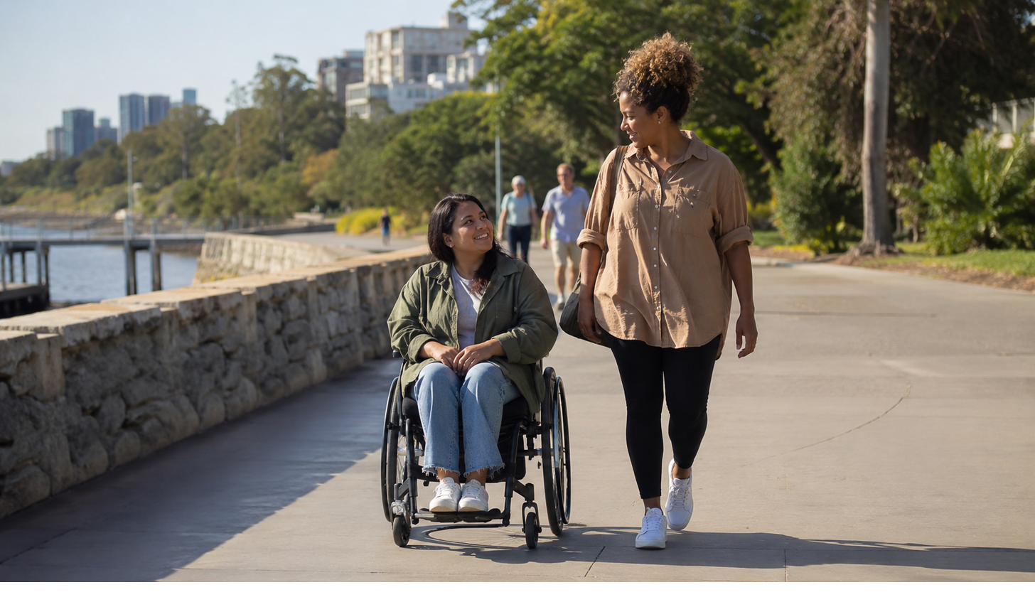 A participant and support worker out in the community together